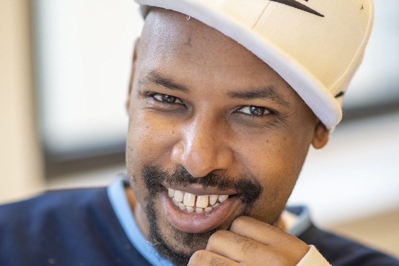 Man with beard smiling warmly