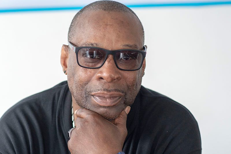 Man wearing sunglasses and black sweater